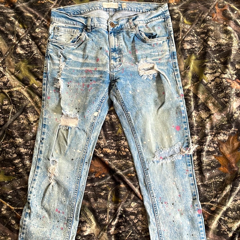 Evolution size 34x34 stonewashed skinny jeans with paint splatter